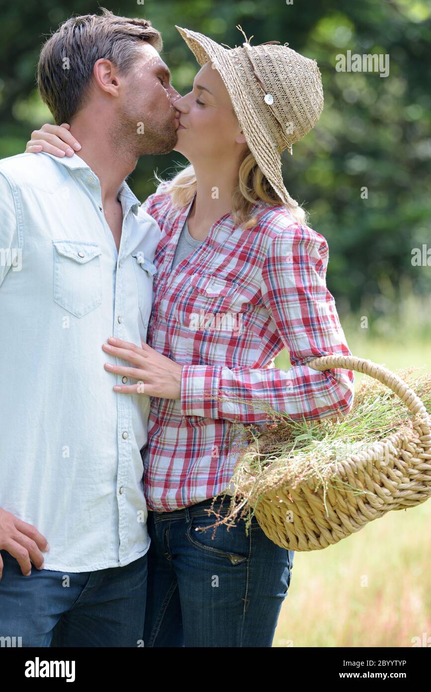 couple kissing in the farm Stock Photo - Alamy
