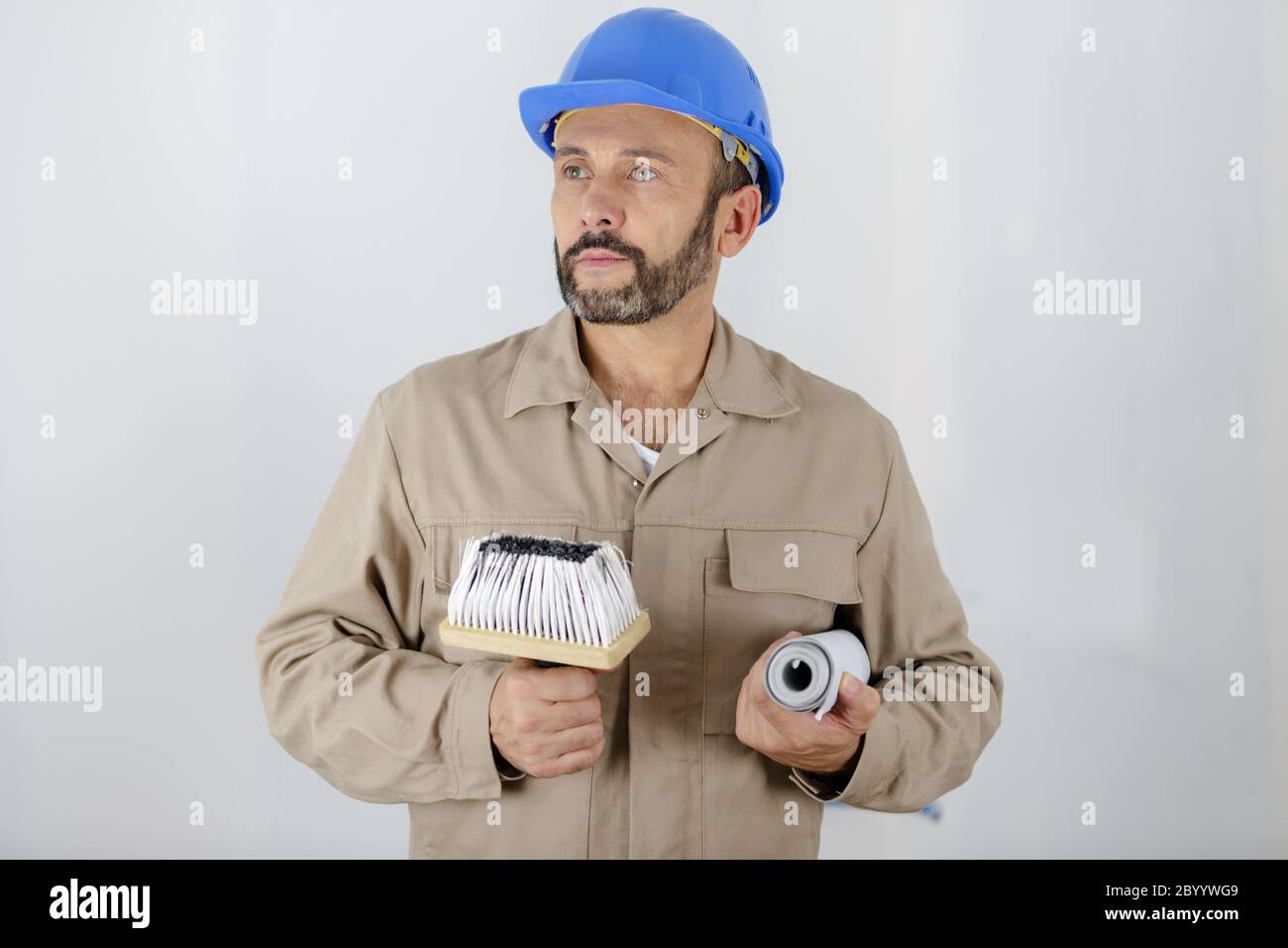 Man Using Art Tools man painter with tools in hands Stock Photo - Alamy
