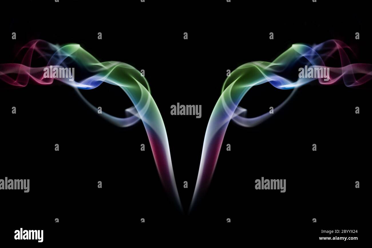 Colored smoke abstract on black background Stock Photo - Alamy