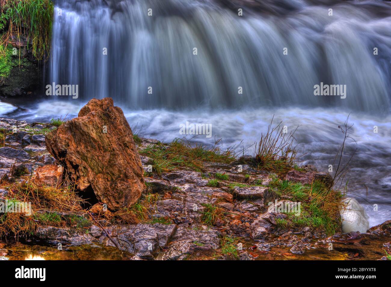 Colorful scenic waterfall in HDR Stock Photo