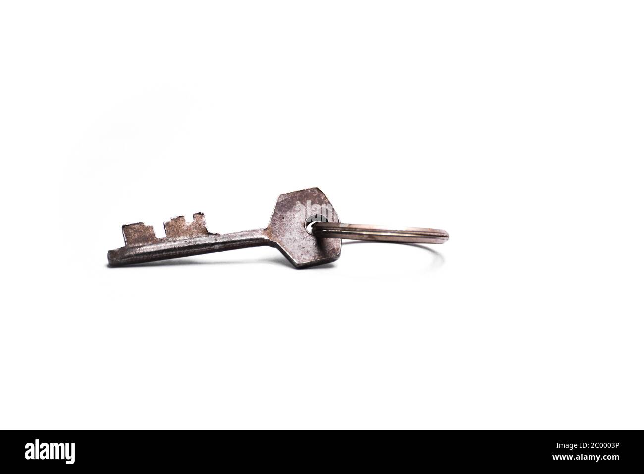Single old key isolated on white background Stock Photo - Alamy