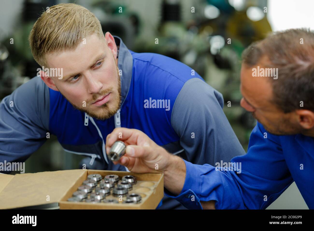Engineer showing metal components hi-res stock photography and images ...