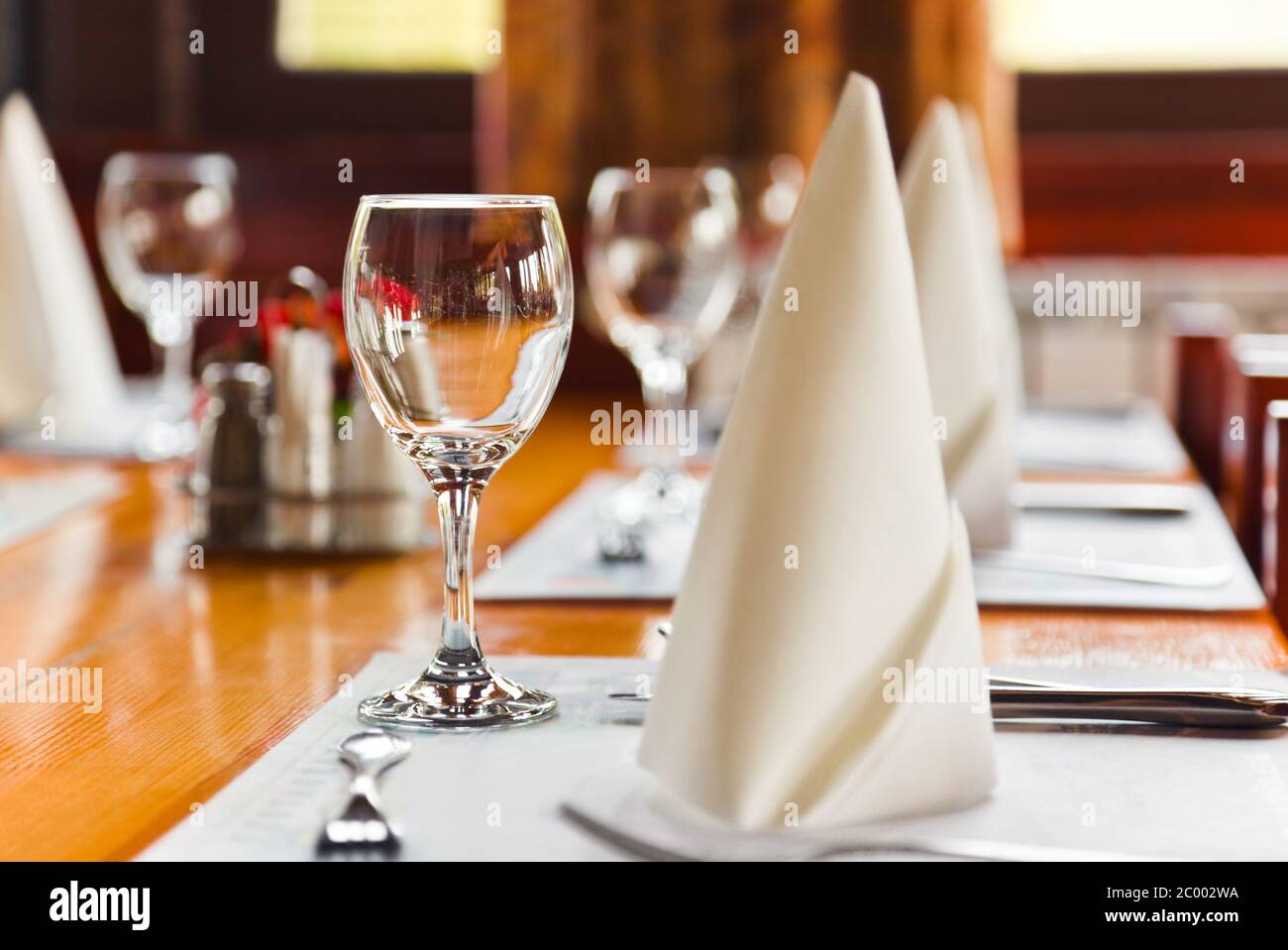 Glasses and plates on table in restaurant Stock Photo Alamy