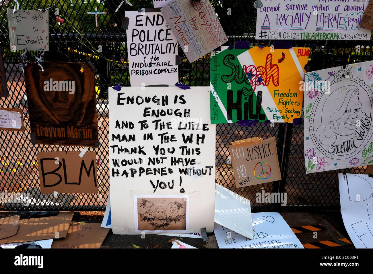 Protest art and signs hang on the fence surrounding Lafayette Square (Lafayette Park)  at Black Lives Matter Plaza, Washington, DC, United States Stock Photo