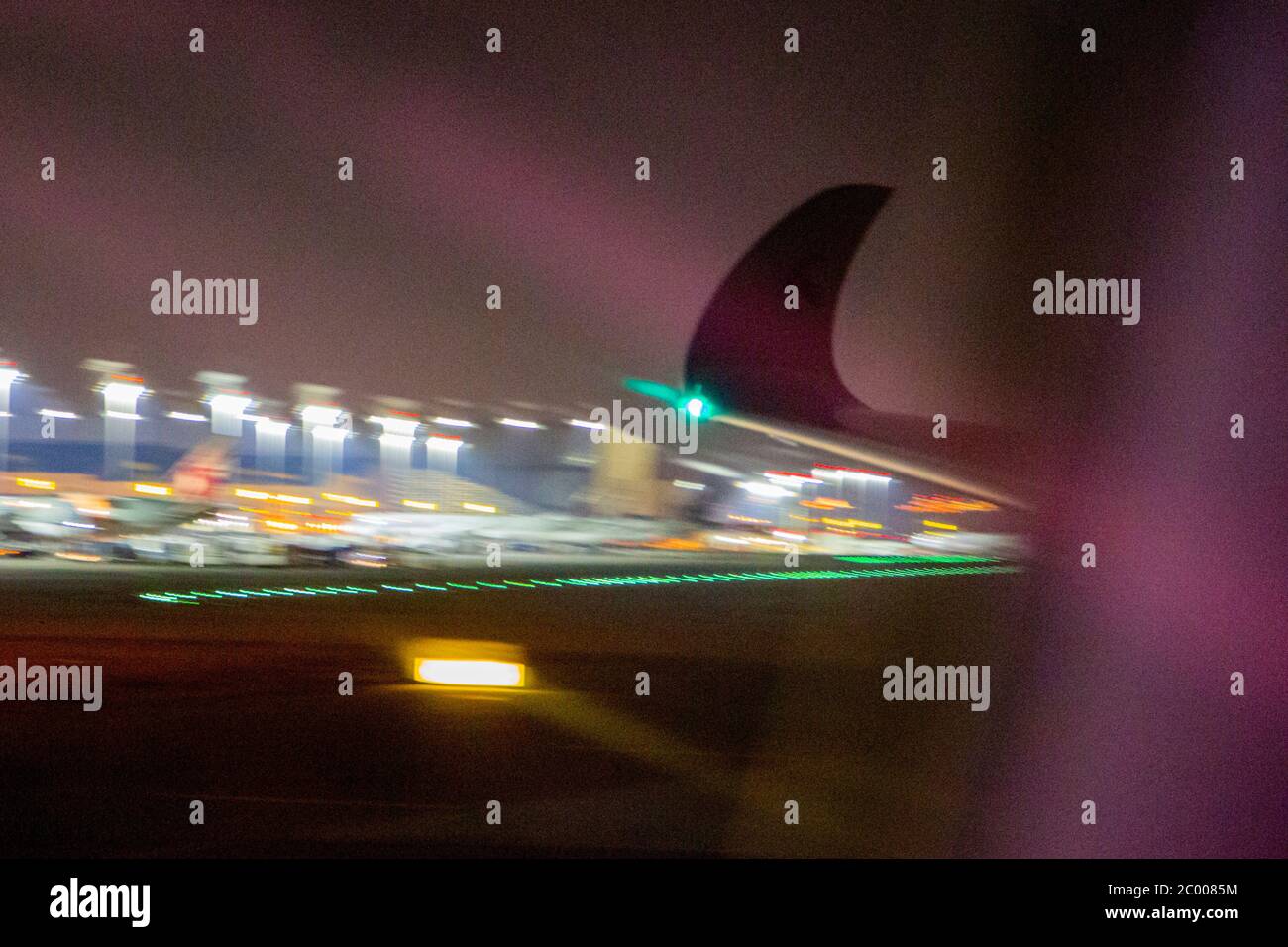 Flying into Doha International Airport during the lockdown caused by the COVID-19 virus. Worldwide, the air traffic industry is heavily impacted by the massive drop in traffic. Stock Photo