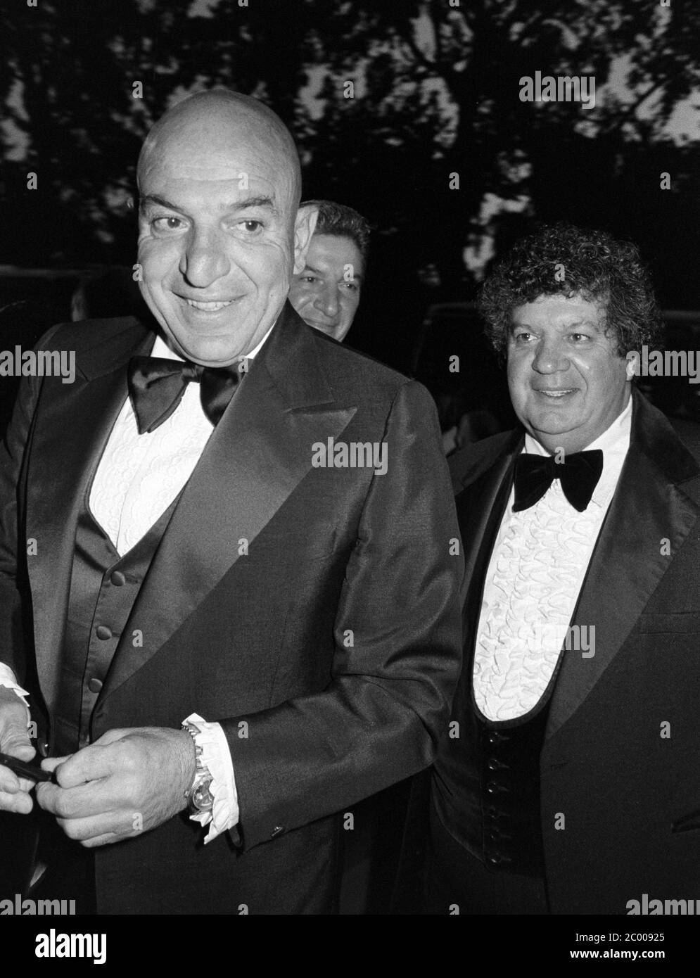 LONDON, UK. Aug 1980: Actors Telly Savalas & George Savalas  at the Bob Hope Classic Golf dinner at the Grosvenor House Hotel in London. © Paul Smith/Featureflash Stock Photo