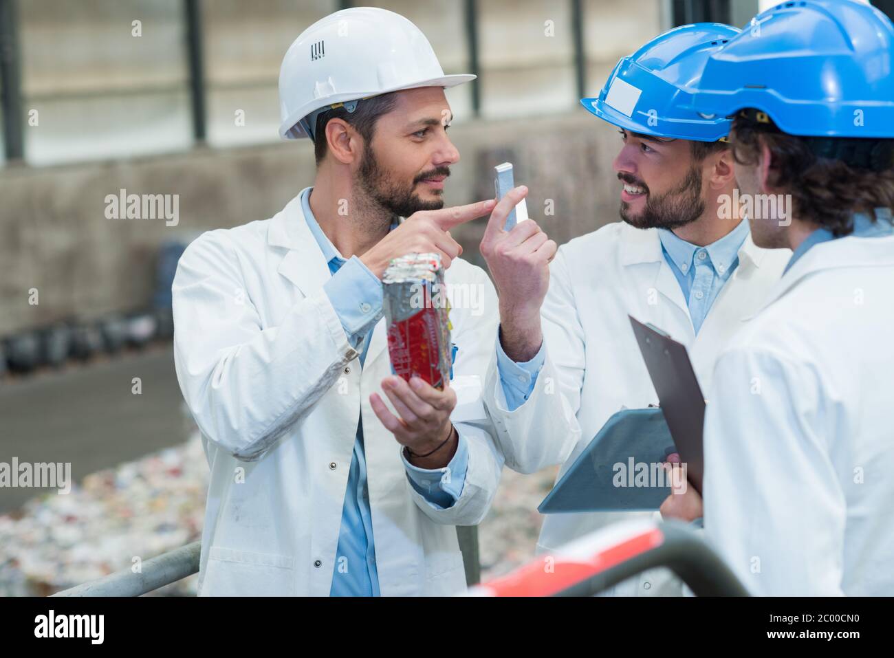three engineer at work Stock Photo - Alamy