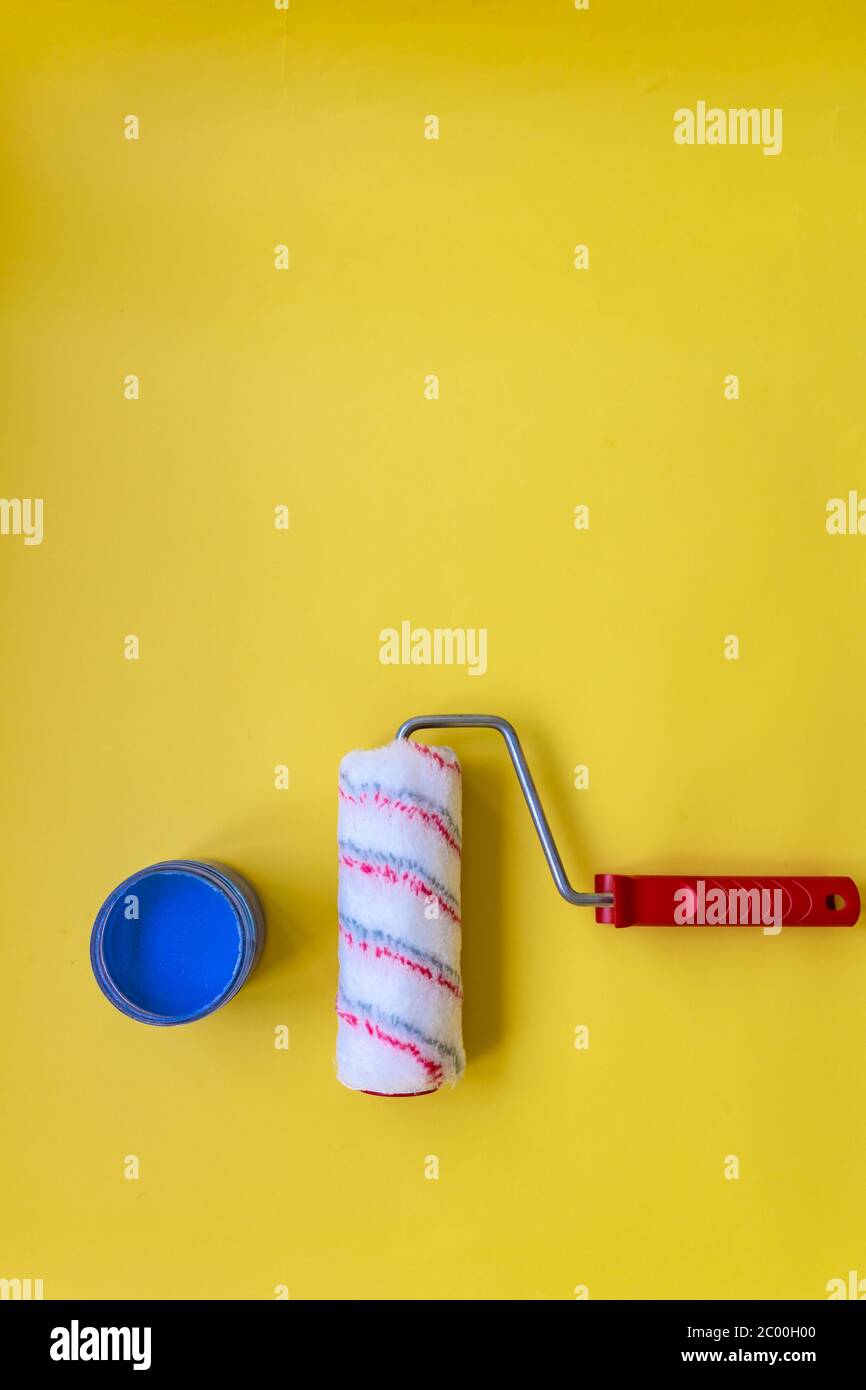 Paint roller for painting and priming new on yellow Background Stock