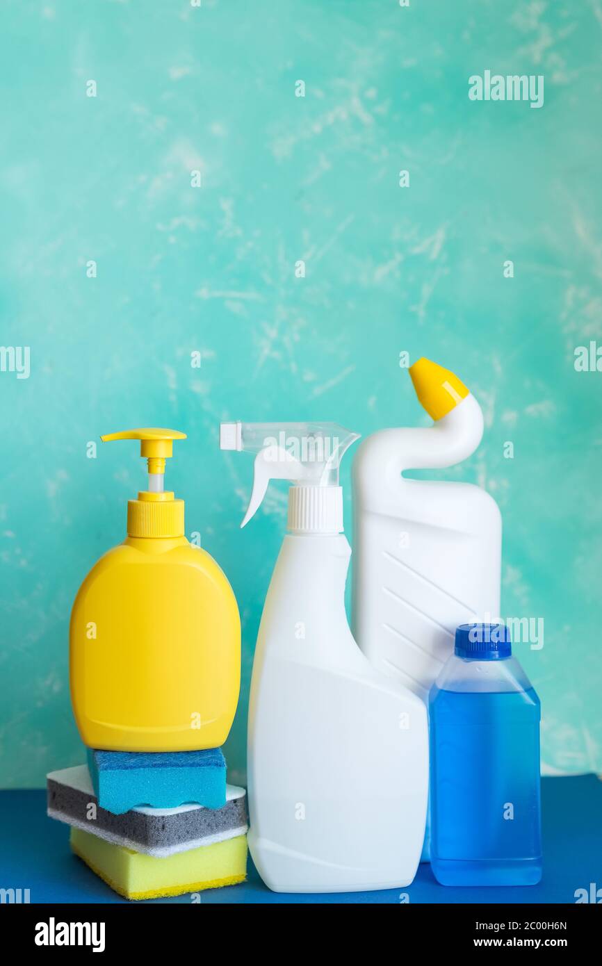 blue washing up dish with cleaning tools and detergents as degreaser and a  brush with wipes insulated on white background Stock Photo - Alamy