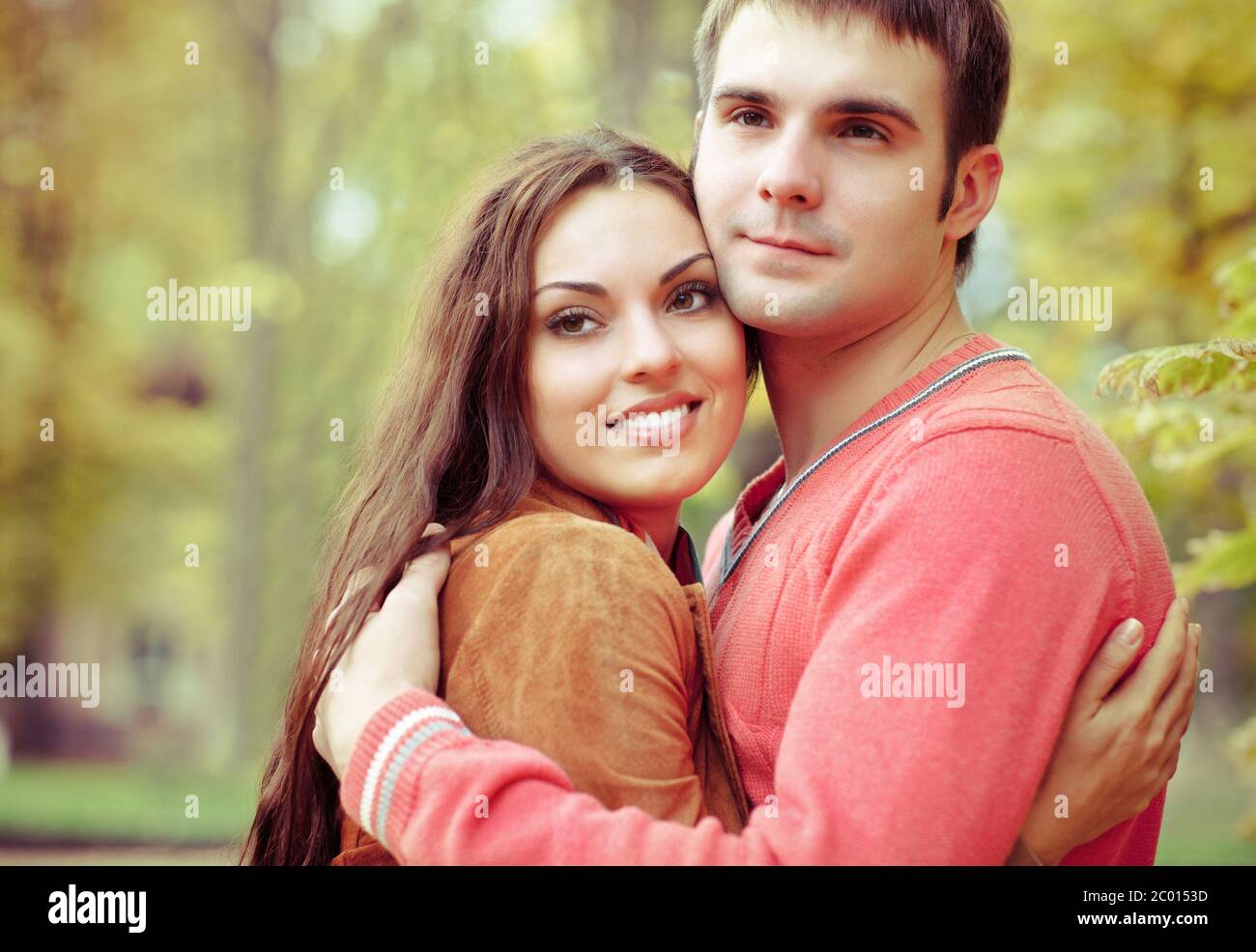 Portrait of couple enjoying golden autumn fall season Stock Photo