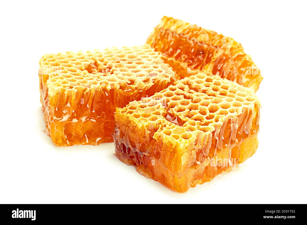Yellow Honeycomb slice closeup isolated on white background Stock Photo