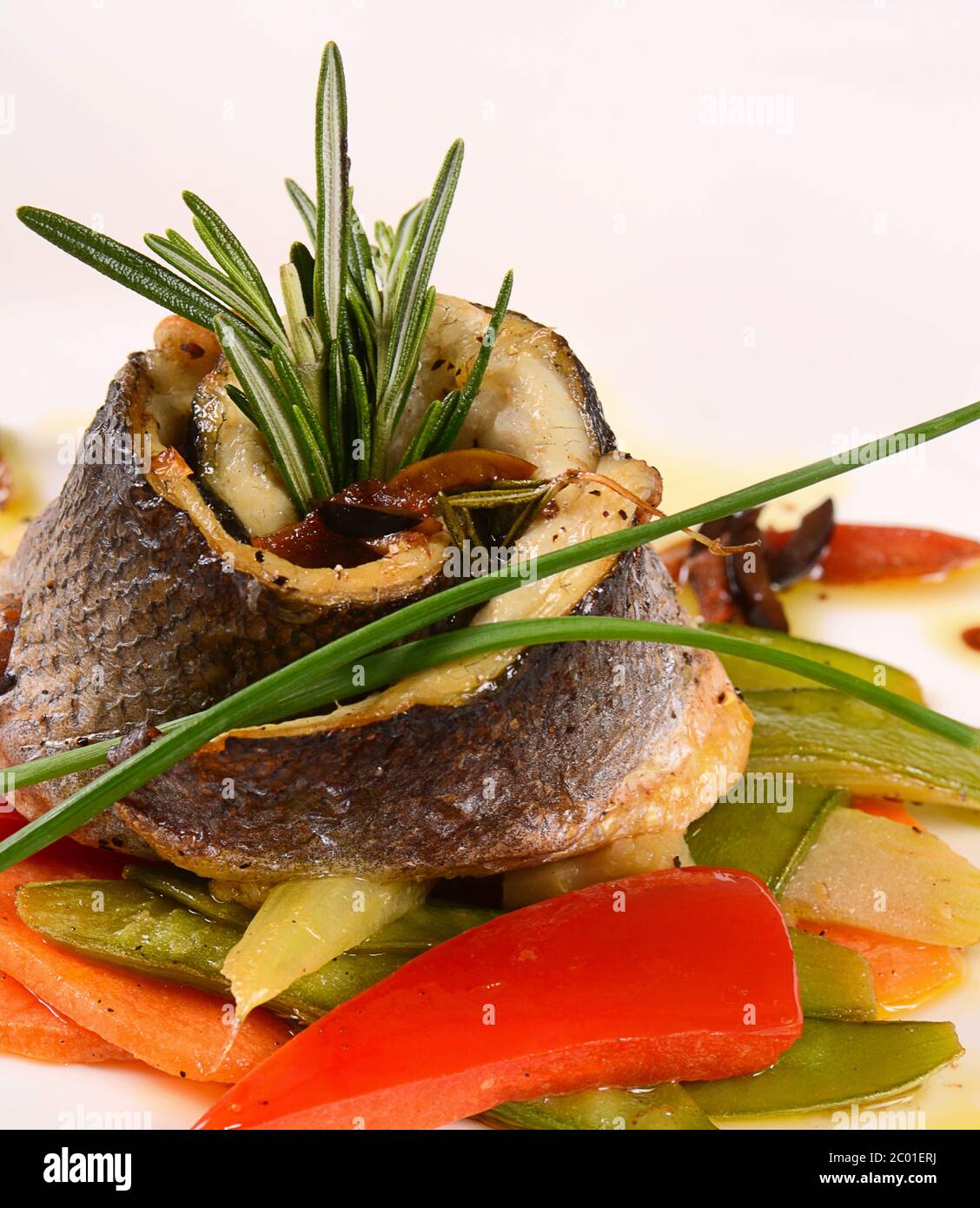 Sea bass fillet with spring vegetables Stock Photo Alamy