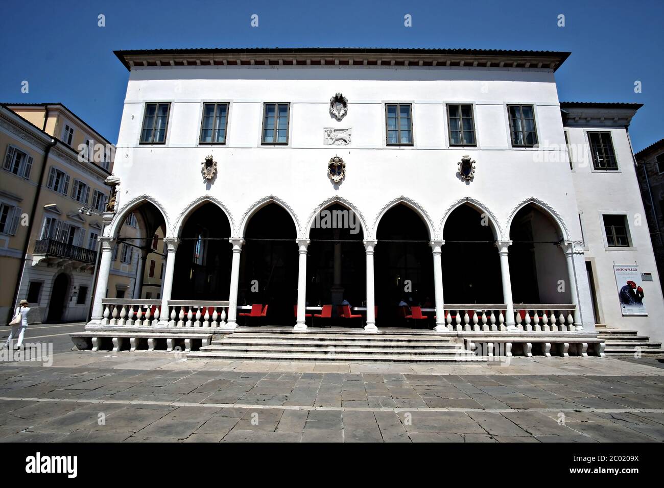 view of the facade with gothic arcades of the Loggia Caffè Kavarna in Tito square in Koper, Slovenia Stock Photo