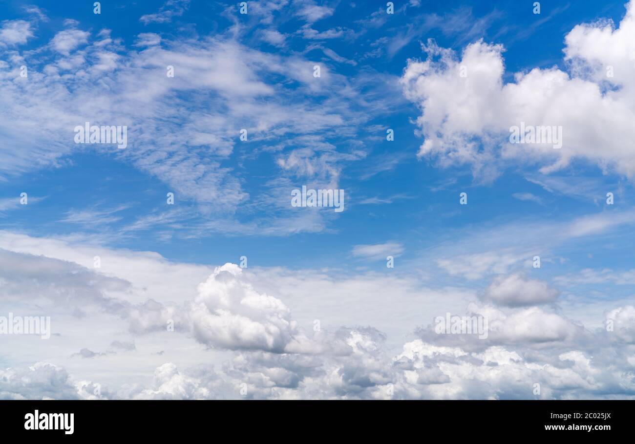 White fluffy clouds on blue sky. Soft touch feeling like cotton. White puffy clouds cape with space for text. Beauty in nature. Close-up white cumulus Stock Photo