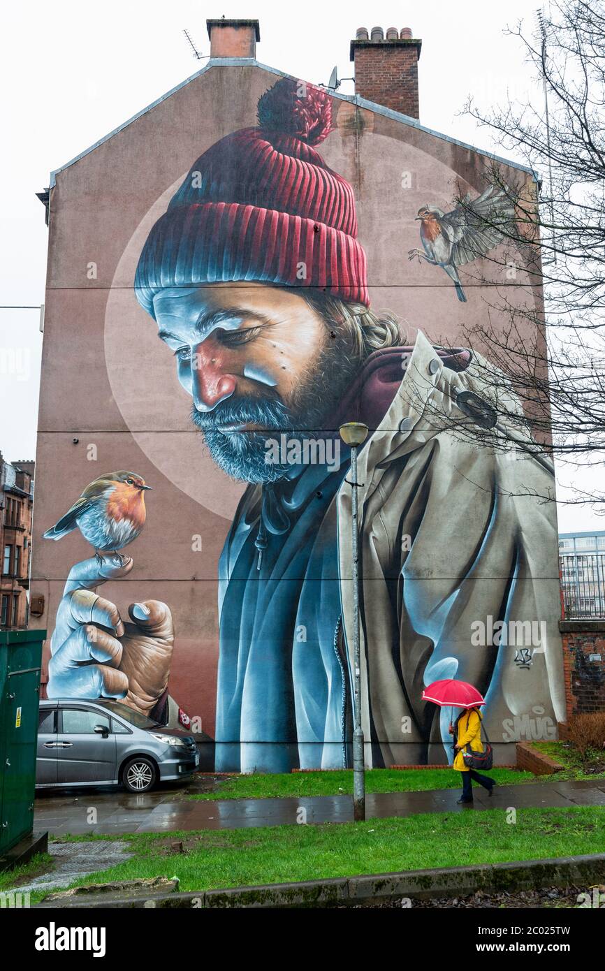 Mural by street artist Smug depicts a modernday St Mungo on gable end