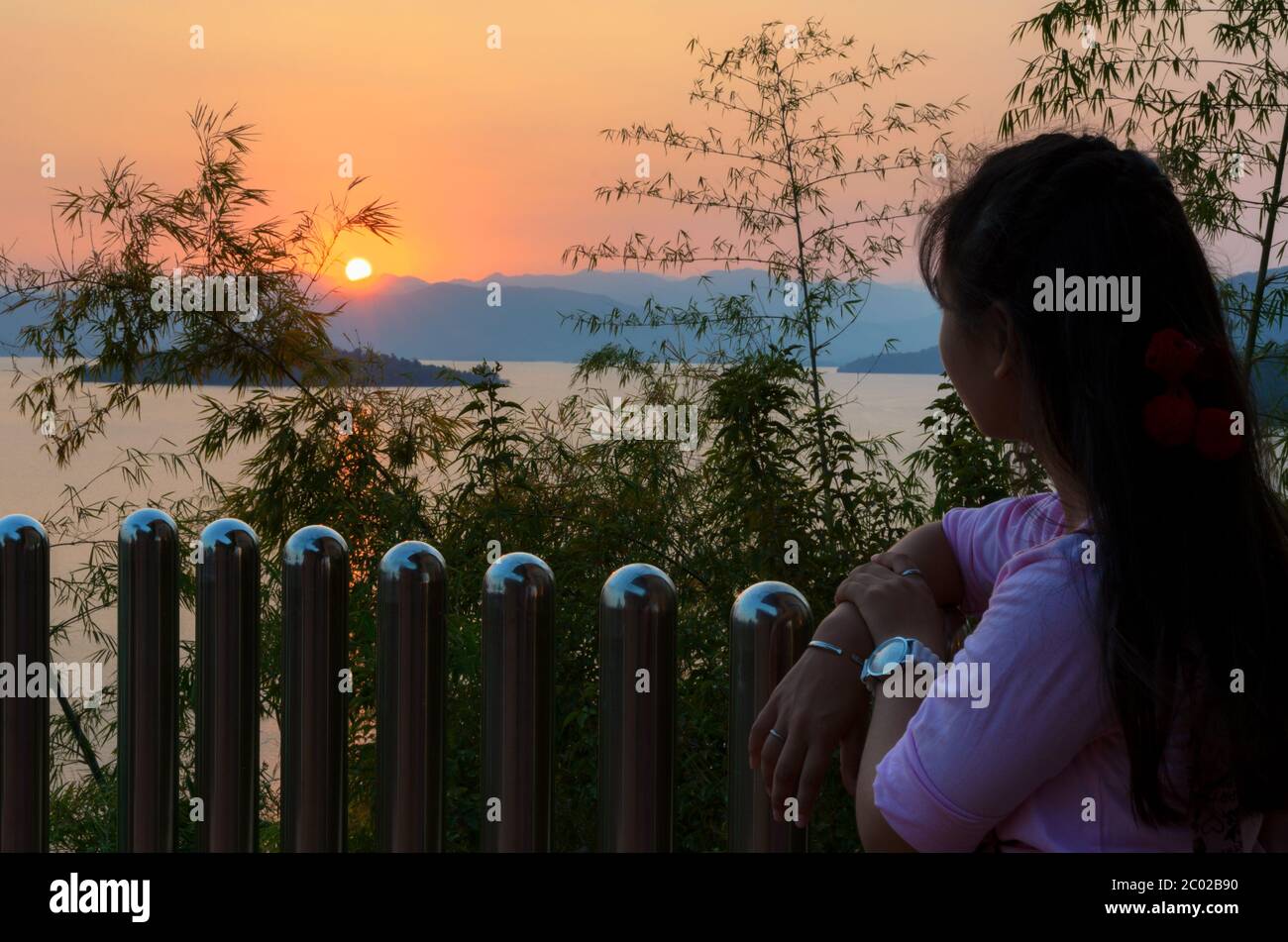 Standing watching the sunset hi-res stock photography and images - Alamy