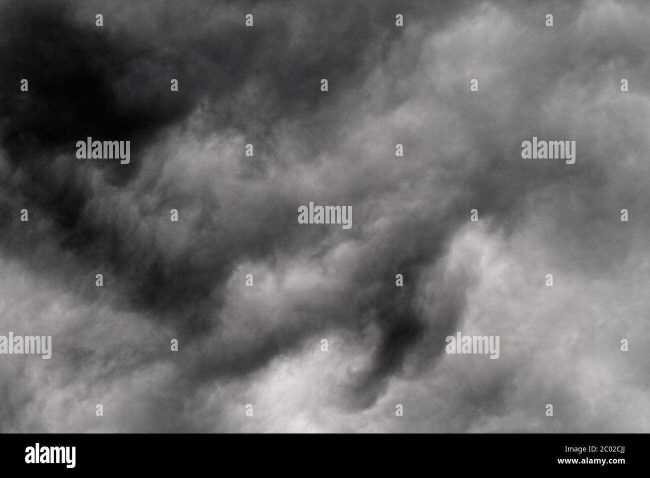 Dark storm clouds before rain - background photo Stock Photo - Alamy