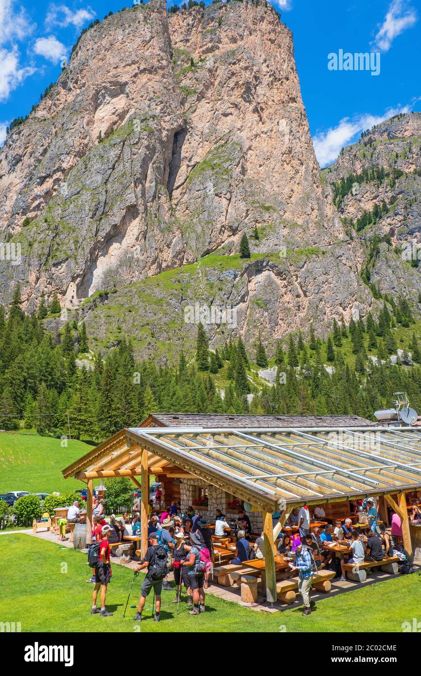 Restaurant with hikers in an alp valley Stock Photo