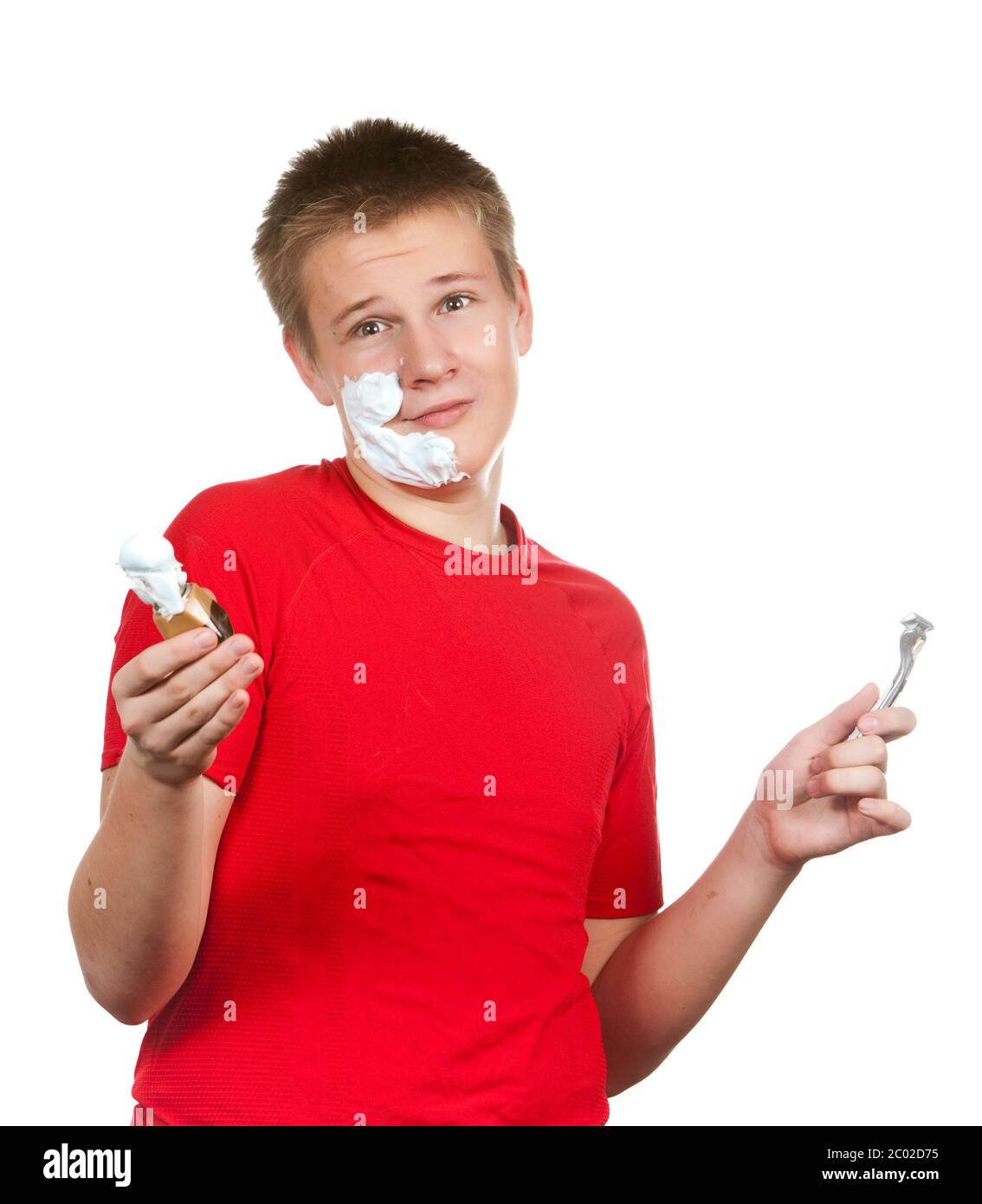 teenager the first time tries to have a shave and Stock Photo Alamy