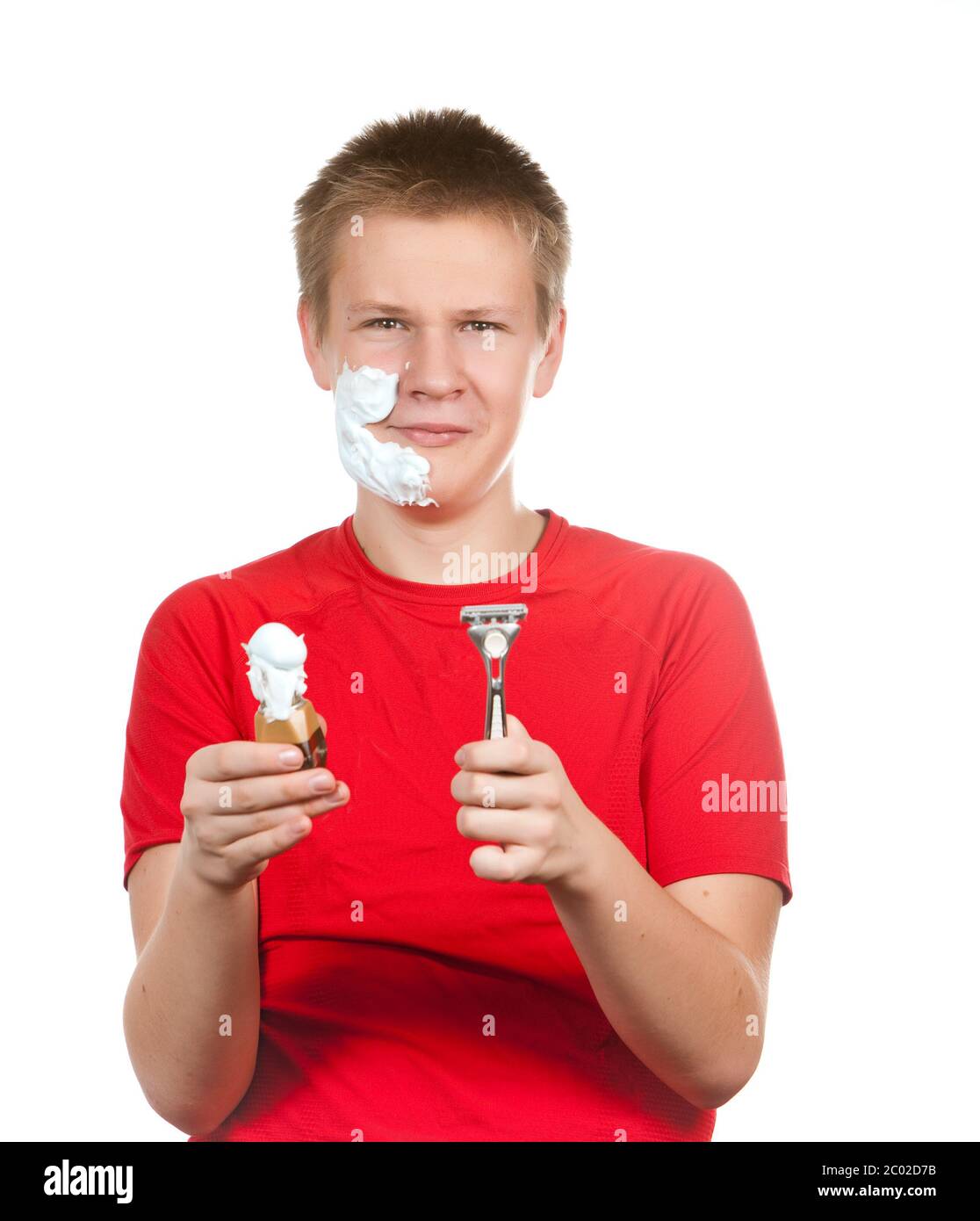 teenager the first time tries to have a shave and Stock Photo Alamy