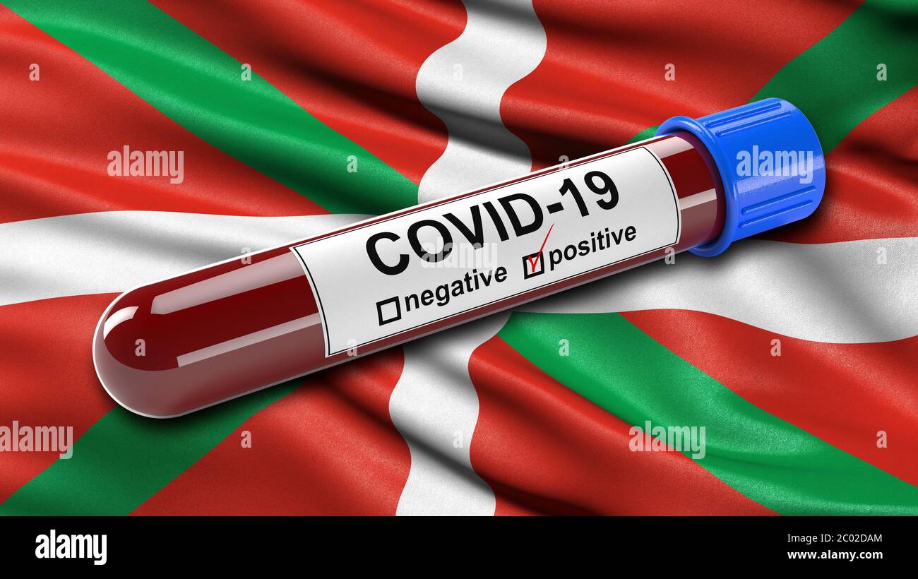 Flag of the Basque Autonomous Community waving in the wind with a positive Covid-19 blood test tube. Stock Photo