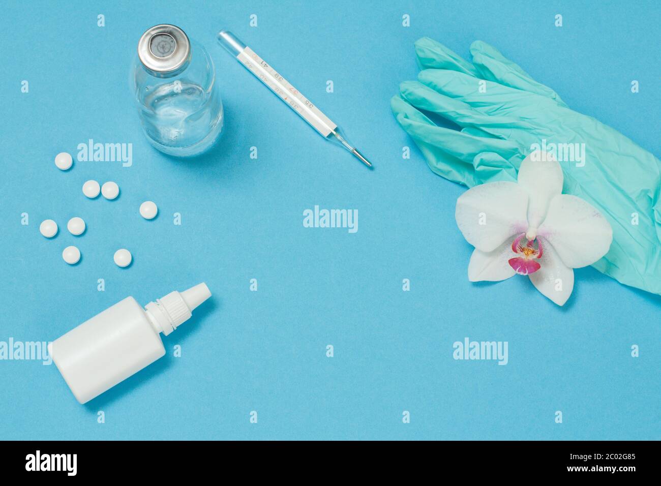 Nasal spray, pills, glass mercury thermometer and nitrile gloves for