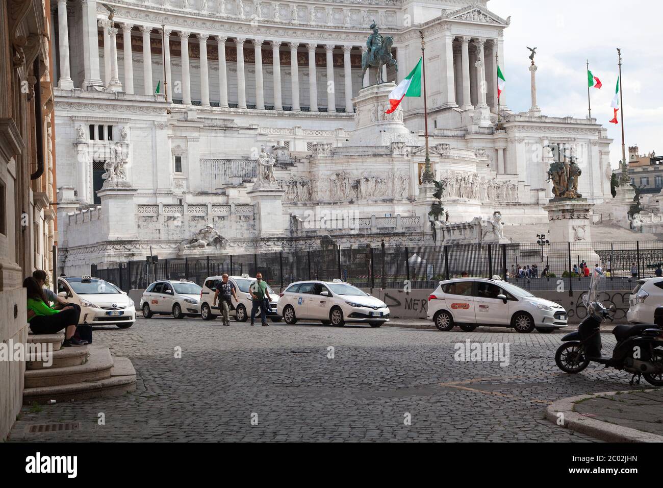 A queue of taxis wait for customers at the Imperial Forums (Fori Imperiali) near Piazza Venezia on June 02, 2020 in Rome, Italy as Italy starts to ease its lockdown, during the country's lockdown aimed at curbing the spread of the COVID-19 infection, caused by the novel coronavirus Stock Photo