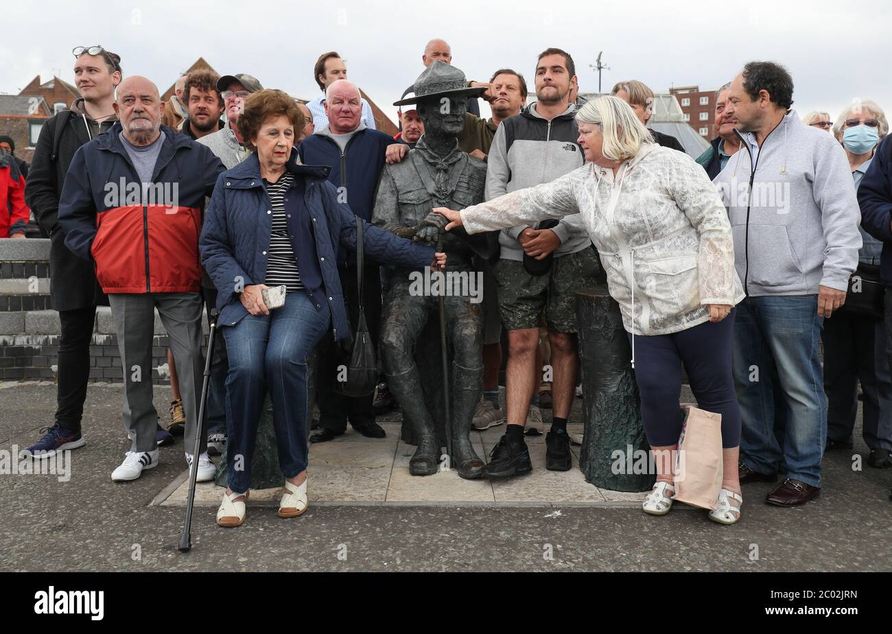 Local residents show their support for a statue of Robert Baden-Powell on Poole Quay in Dorset ahead of its expected removal to 'safe storage' following concerns about his actions while in the military and 'Nazi sympathies'. The action follows a raft of Black Lives Matter protests across the UK, sparked by the death of George Floyd, who was killed on May 25 while in police custody in the US city of Minneapolis. Stock Photo