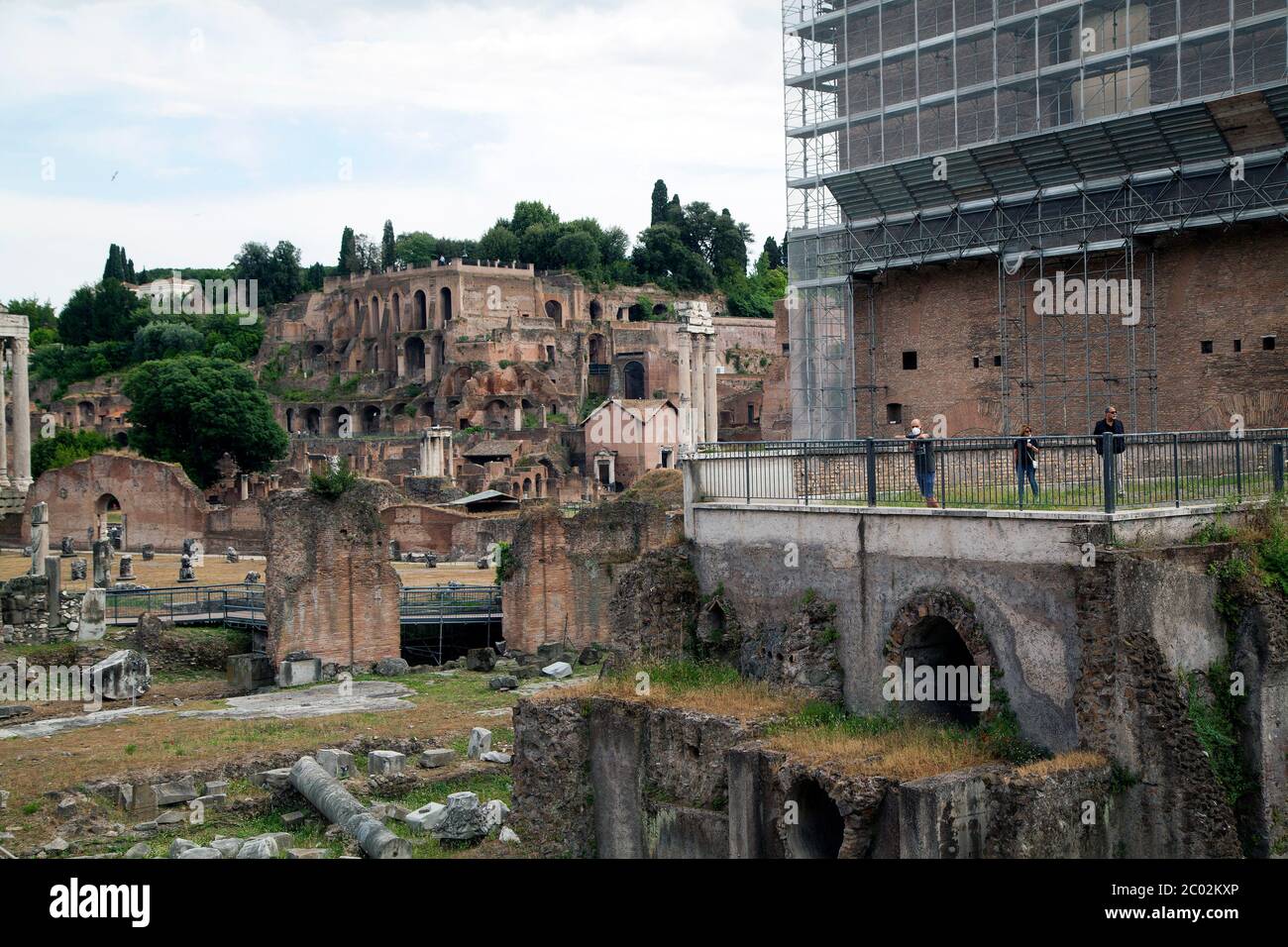 Still few tourists in Rome after Covid19 lockdown. People wearing a protective face mask visits Fori Imperiali Area in Rome, Italy, on Tuesday, June 02, 2020. Stock Photo
