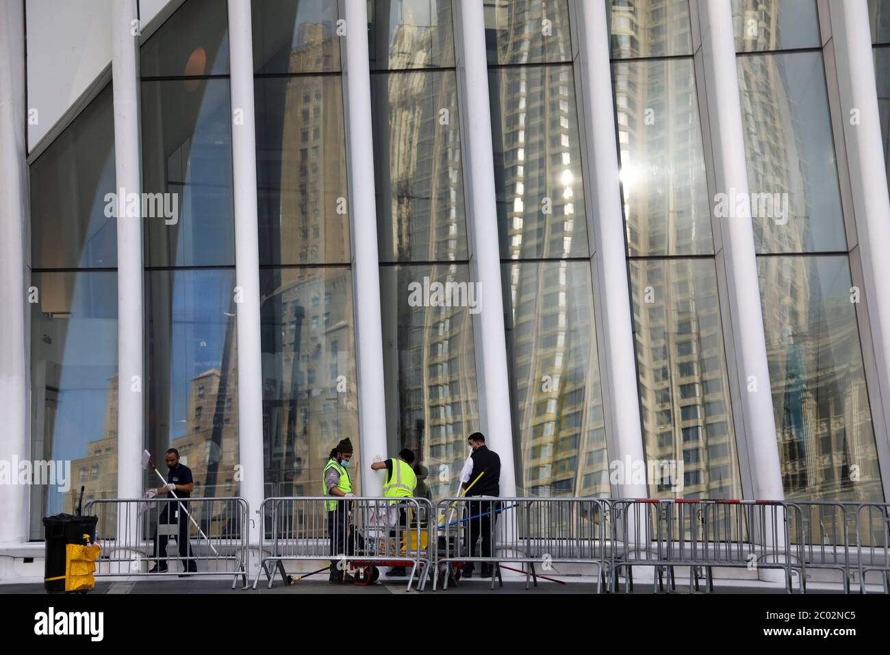 (200611) -- NEW YORK, June 11, 2020 (Xinhua) -- Janitors clean the exterior of the Oculus of the World Trade Center in New York, the United States, June 10, 2020. The number of COVID-19 cases in the United States surpassed the 2 million mark Wednesday to reach 2,000,464 as of 11:33 p.m. local time (0333 GMT Thursday), according to the Center for Systems Science and Engineering (CSSE) at Johns Hopkins University. (Xinhua/Wang Ying) Stock Photo