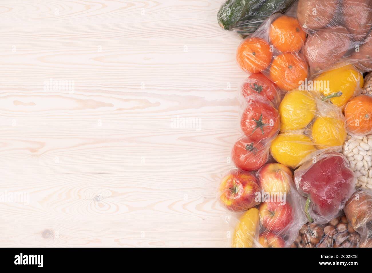 Plastic packaging. Fruits and vegetables in plastic bags Stock Photo Alamy