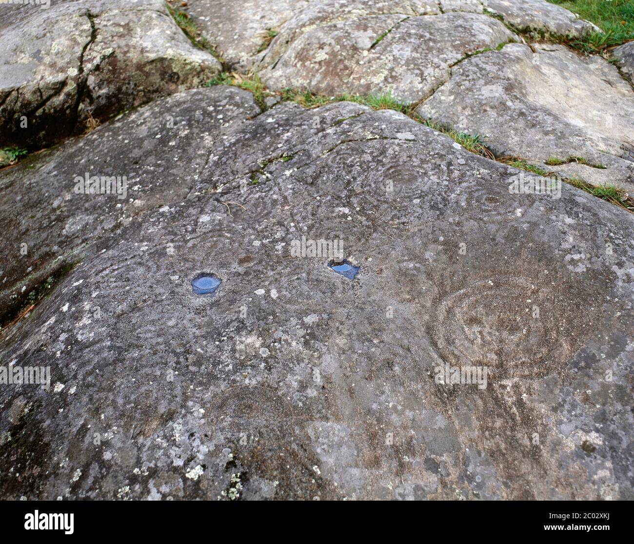 Petroglyphs of Mogor carving on the rock. 'Labyrinth of Mogor', one of the three petroglyphs that remain visible in Mogor. Metal Ages. c. 3.000-2000 BC. Municipality of Marin, Pontevedra province. Galicia, Spain. Stock Photo