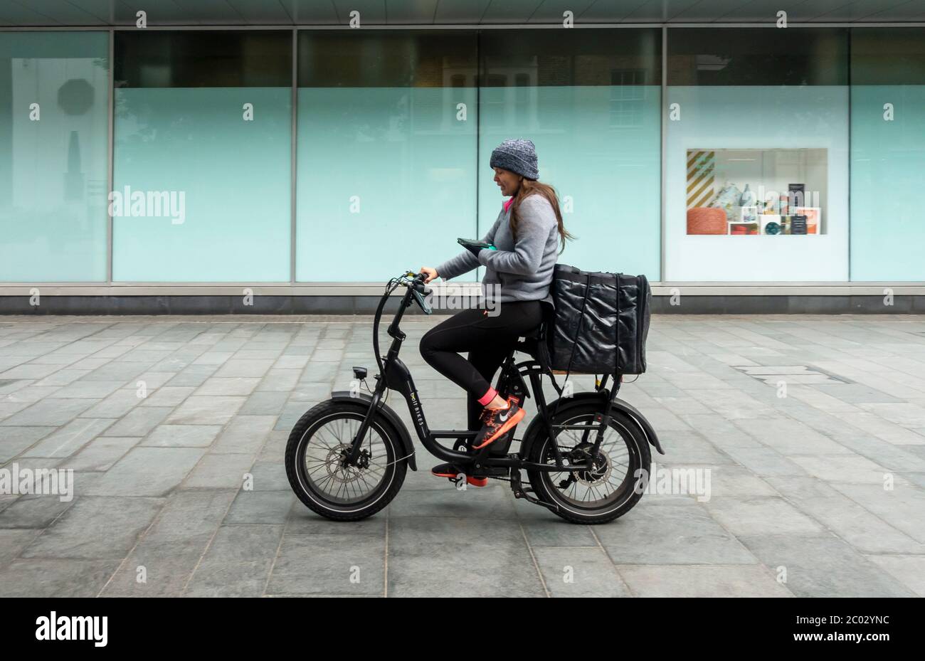 A young woman doing bicycle food delivery in Liverpool Stock Photo Alamy