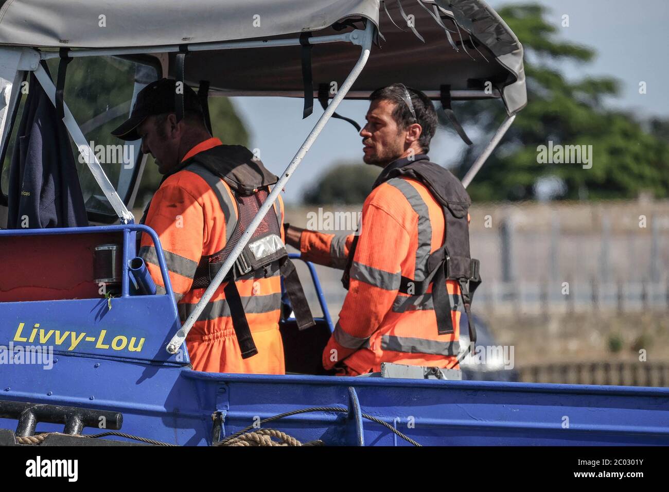 men at work on boat Stock Photo Alamy