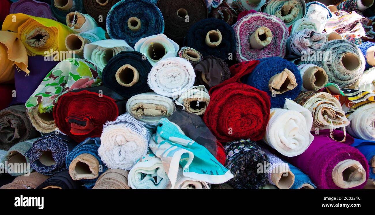 fabric of different colors in rolls Stock Photo