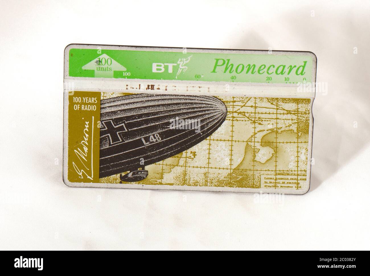 British Telecom pre paid public telephone card with image on Zeppelin L48 and it's final location, shot down using radio Stock Photo