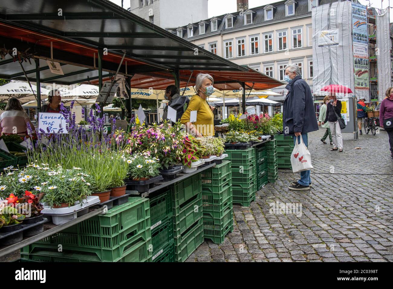 German people going about their everyday lives after the coronavirus lockdown restrictions are relaxed in Braunschweig, north-central Germany Stock Photo