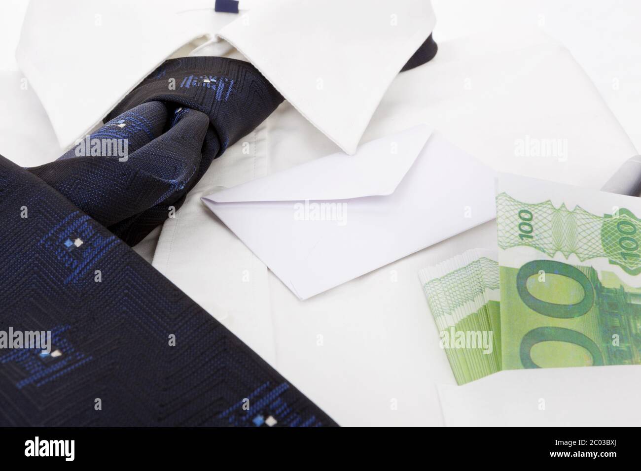 Dress shirt, envelope and money. Business still life. Stock Photo