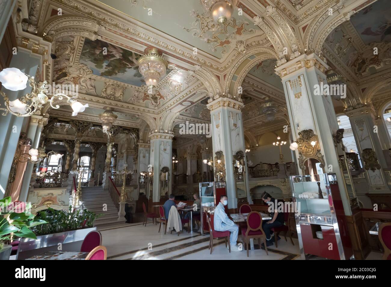 (200611) -- BUDAPEST, June 11, 2020 (Xinhua) -- Customers are seen at the reopened New York Cafe in Budapest, Hungary, June 10, 2020. Customers are allowed to enter the inside of cafe bars as the novel coronavirus pandemic has subsided and the COVID-19 restrictions were gradually lifted in Hungary. (Photo by Attila Volgyi/Xinhua) Stock Photo