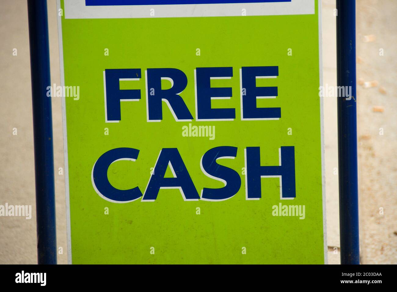 Sign: Free Cash, considered misleading as the cash is not free - there is simply no charge for the service of providing it Stock Photo