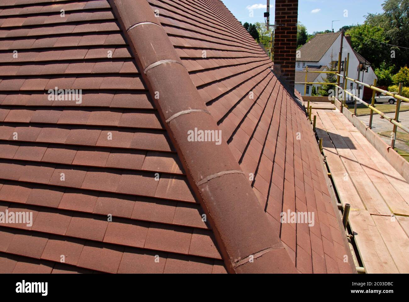 Covered corner of domestic house roof during re-roofing process, Kent, England Stock Photo