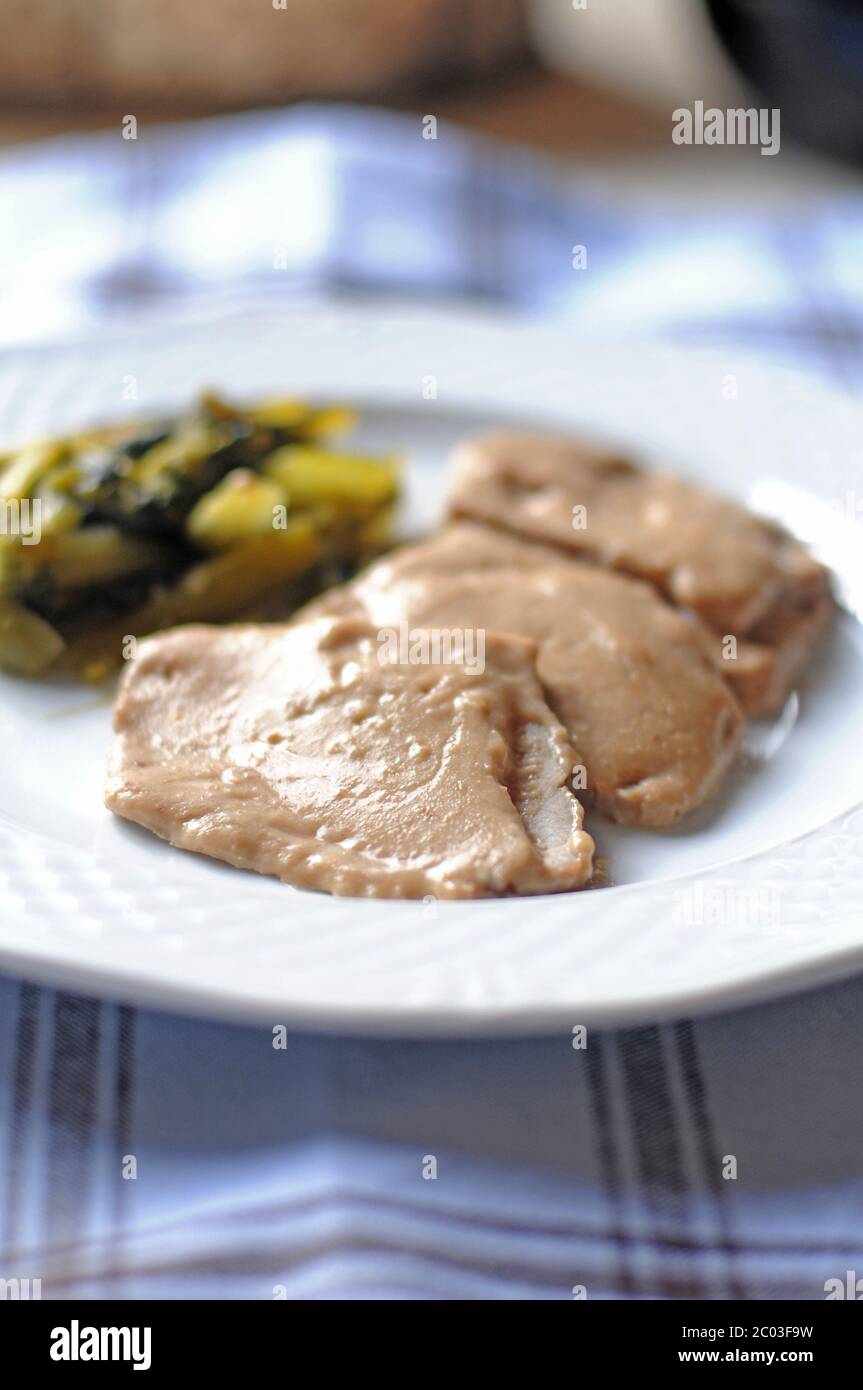 Pork cooked in milk Stock Photo Alamy