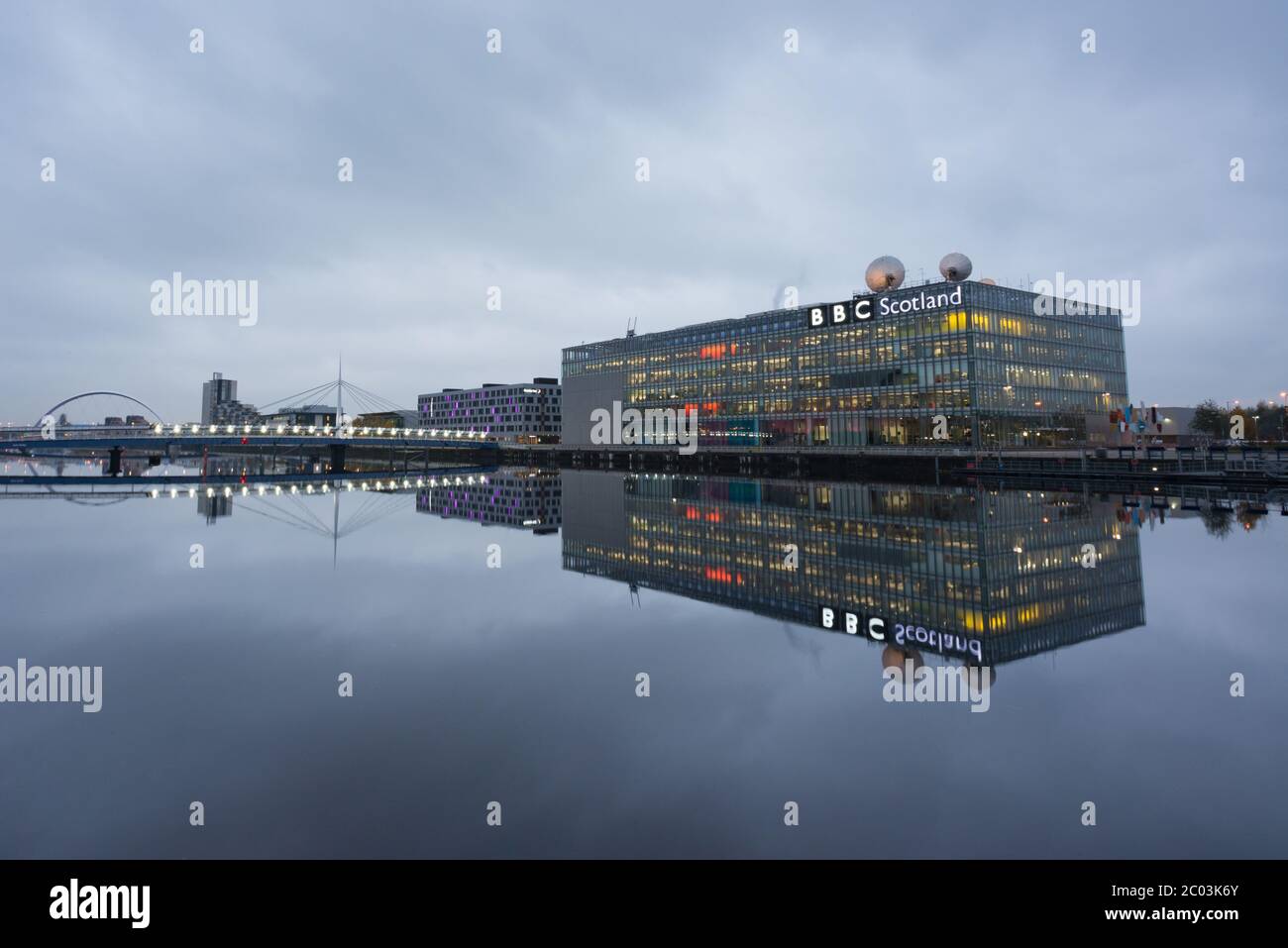 The BBC Scotland building reflected in the River Clyde in Glasgow, Scotland Stock Photo