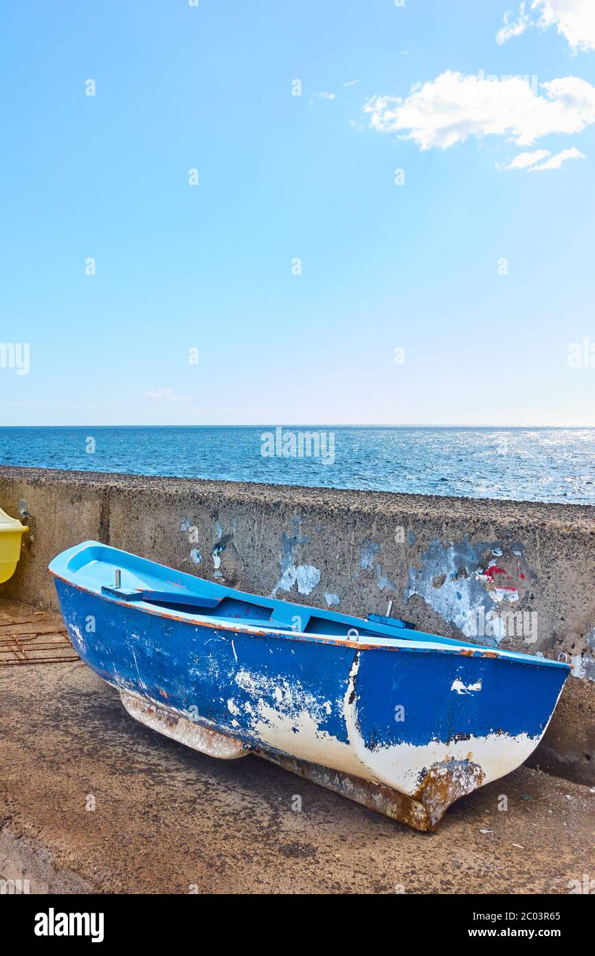 Old small fishing boat ashore by the sea, Canary Islands Stock Photo