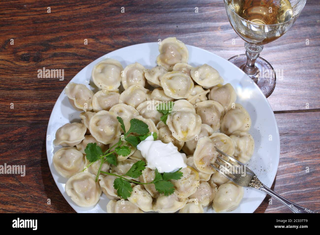 Wine and pelmeni in a plate Stock Photo