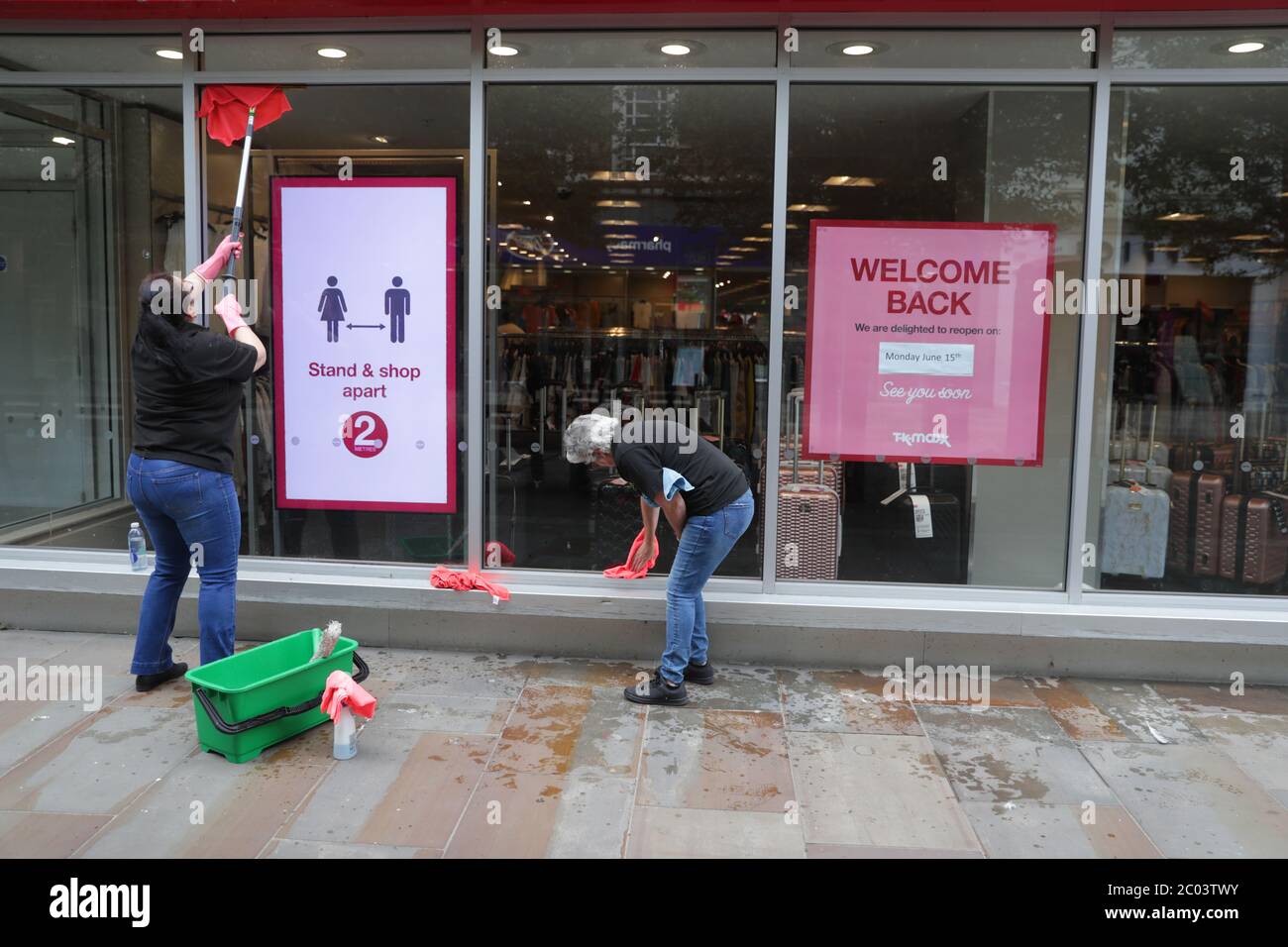 A TK Maxx shop front is cleaned as they prepare to reopen in Worcester on June 15, following the introduction of measures to bring England out of lockdown. Stock Photo