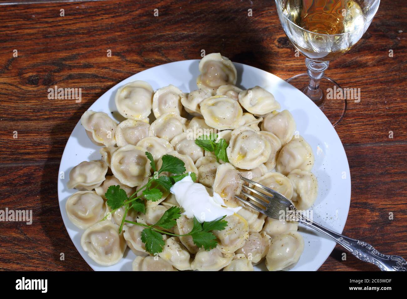 Wine and pelmeni in a plate Stock Photo