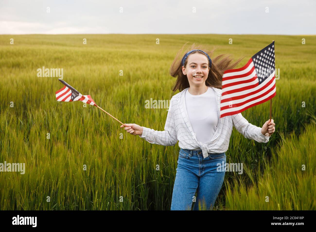Teen holding american flag hi-res stock photography and images - Alamy