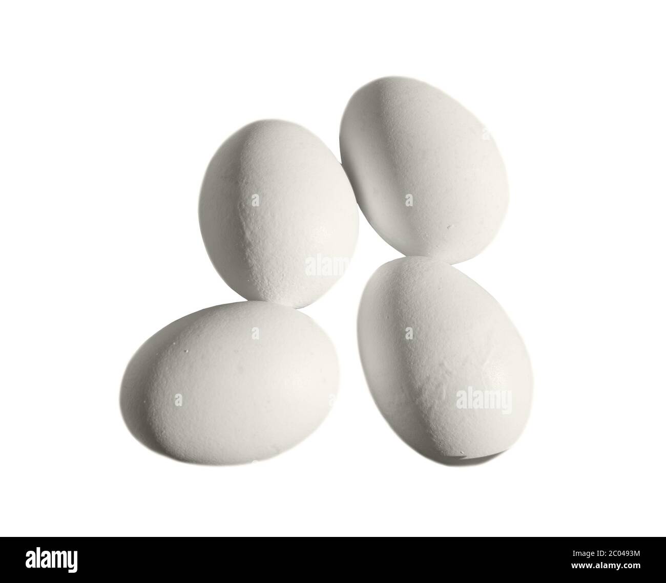 Four plain white eggs isolated Stock Photo Alamy