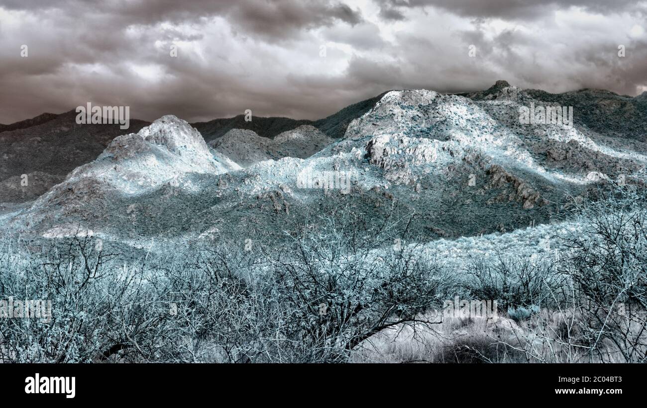 650nm Infrared Landscape Image with mountains in Pinal County of Southern Arizona in the Desert vegetation of the Tucson area in Winter February 2020 Stock Photo